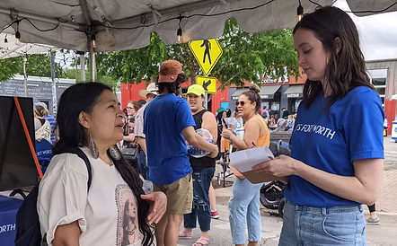 A friendly volunteer at an event.